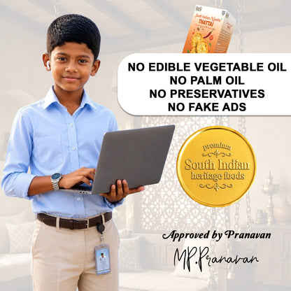 A promotional graphic featuring a young boy in a light blue shirt and beige trousers holding a laptop, with a South Indian Heritage Pranavan Food product box and a gold seal on a light background. Text reads 'NO EDIBLE VEGETABLE OIL NO PALM OIL NO PRESERVATIVES NO FAKE ADS' and 'Approved by Pranavan MP.Pranavan