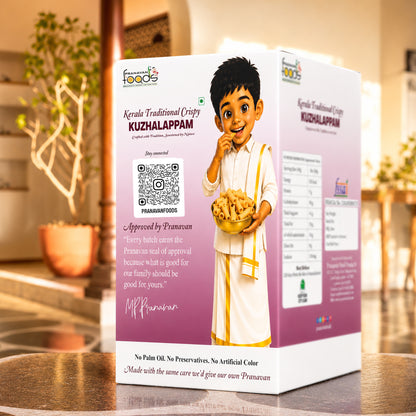 A boxed food product labeled 'Kerala Traditional Crispy Kuzhalappam' stands on a wooden table in a warm indoor setting. The box is predominantly white and pink/lilac with an illustrated child in traditional clothing holding a bowl of appam, plus product details, a QR code, and approval text.