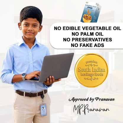 A promotional graphic featuring a young boy in a light blue shirt and beige trousers holding a laptop, alongside product packaging for South Indian Heritage Foods Upperi, a gold seal, and text stating 'NO EDIBLE VEGETABLE OIL NO PALM OIL NO PRESERVATIVES NO FAKE ADS' with 'Approved by Pranavan MP.Pranavan' at the bottom.
