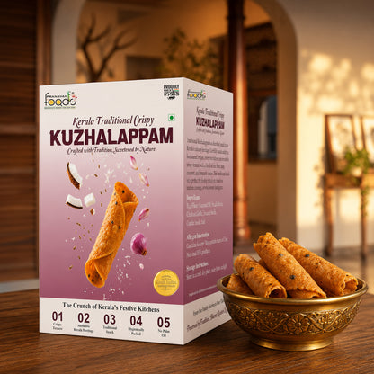 A box of Kerala Traditional Crispy Kuzhalappam snack is shown on a wooden table next to a gold bowl filled with rolled crispy snacks. The background is a softly blurred warm indoor setting.