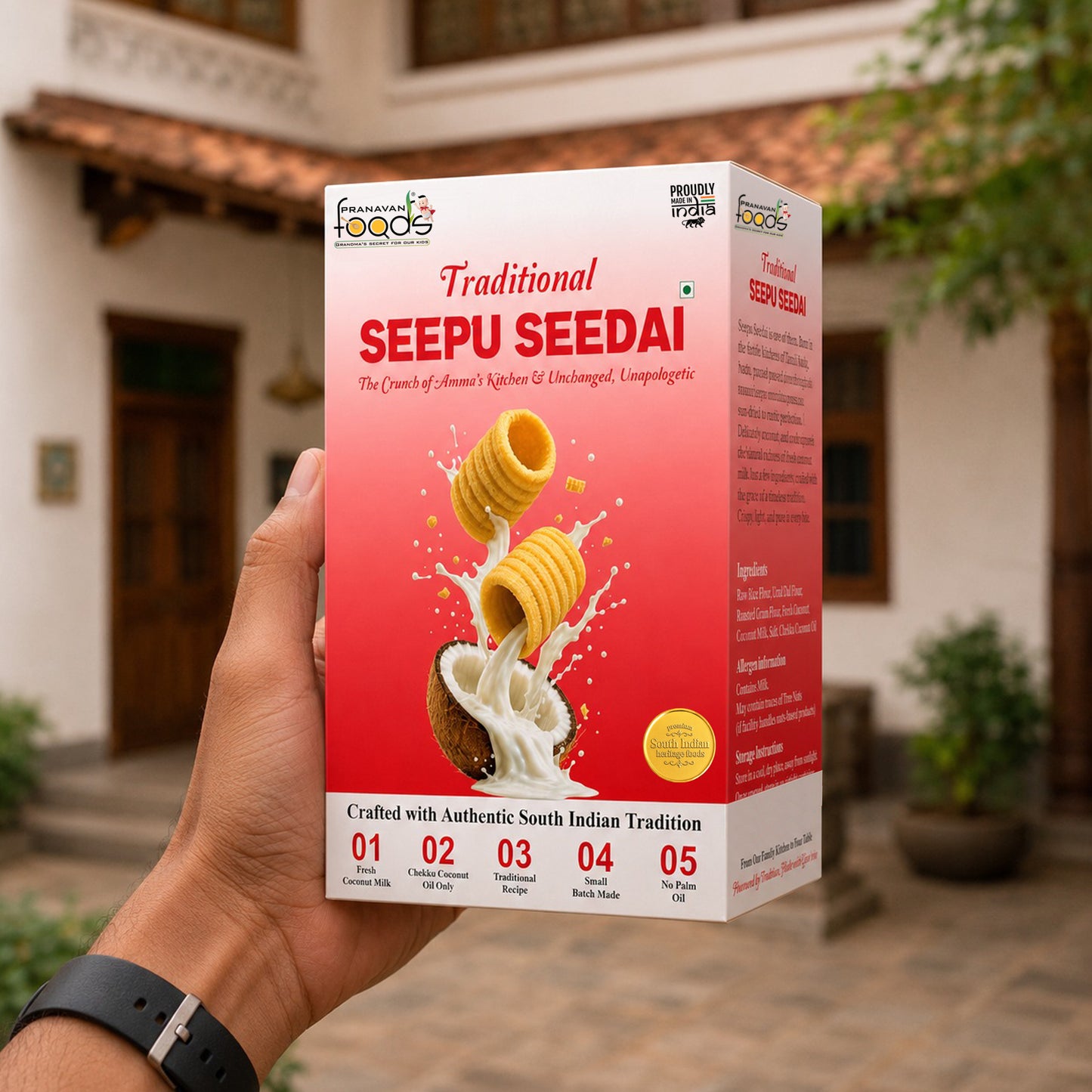 A hand holds a box of Seepu Seedai Traditional by Pranavan Foods against a blurred outdoor background of a building and greenery.